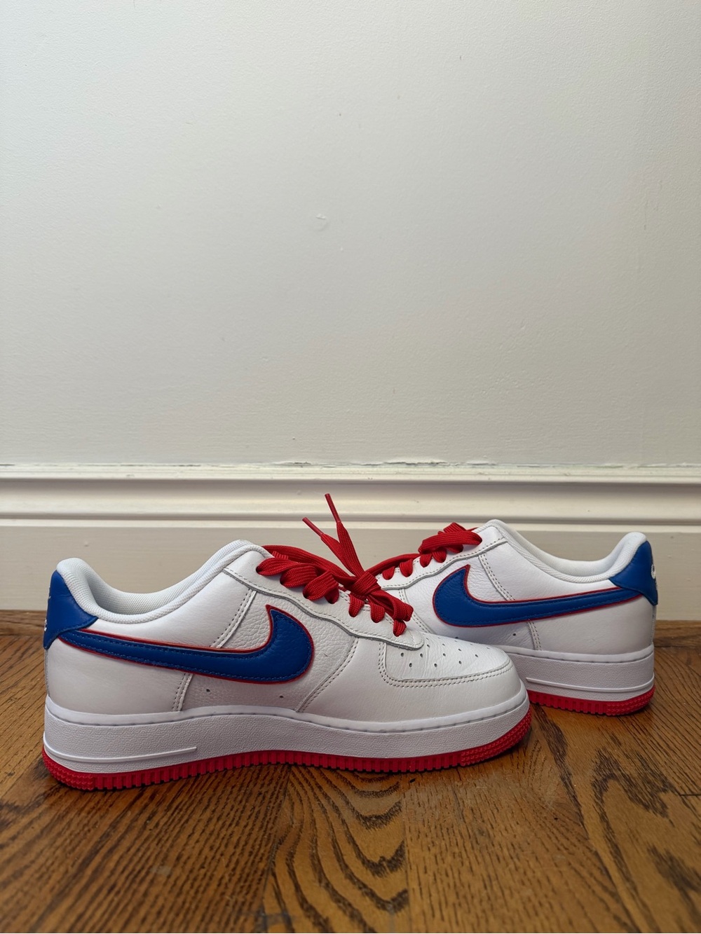 Nike Air Force 1 Sneakers with Blue Swoosh and Red Accents